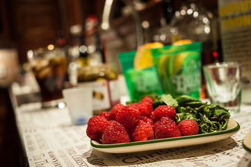 Raspberries on a bar