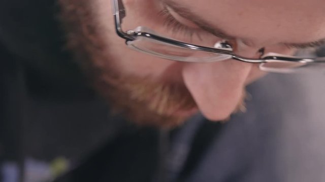Man Preparing Bike Inner Tube for Patching TILT DOWN