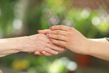 Helping hands, care for the elderly concept