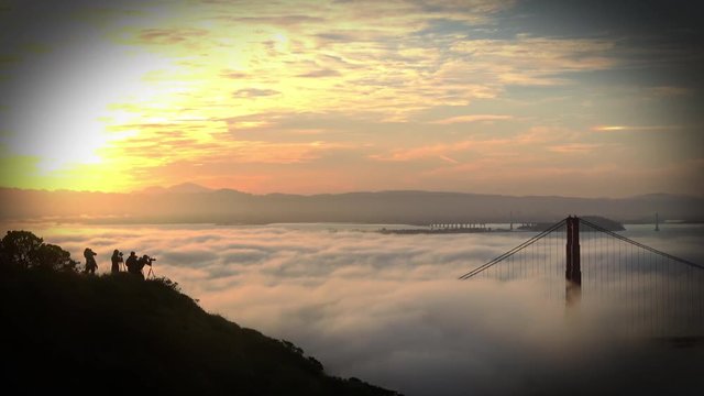 Photographers taking Pictures of the Foggy San Francisco Golden Gate Sunrise