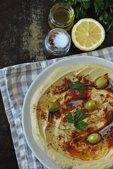Fresh homemade hummus with olive oil and spices. Middle Eastern cuisine.
