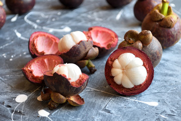 Fresh mangosteen fruits isolated on neutral background.