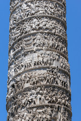 Architectural detail from of ancient Marcus Aurelius Column in front of Palazzo Chigi in city of Rome, Italy