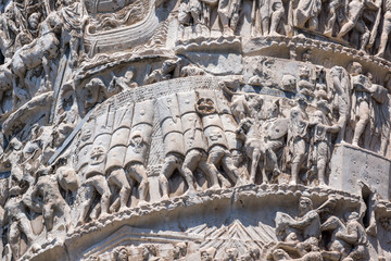 Architectural detail from of ancient Marcus Aurelius Column in front of Palazzo Chigi in city of Rome, Italy