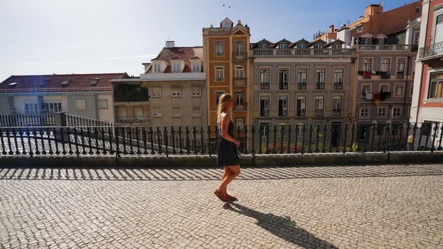 A Girl is walking though a view point in Lissabon, Portugal.