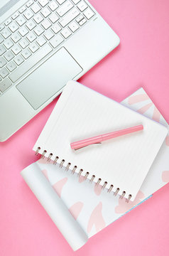 Ultra Feminine Cluttered Pink Desk Workspace With Touch Screen Laptop Closeup, Overhead Flatlay.