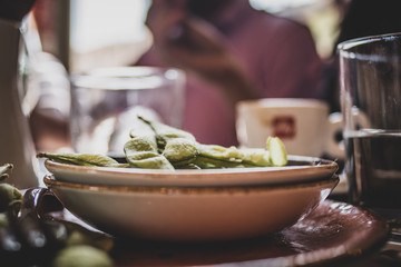 Plate of healthy edamame beans on a table in a cafe. 