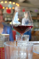 Red Wine In A Wine Glass in Restaurant. The Side View