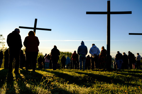 Images from a mountaintop sunrise Easter service in Virginia with crosses.