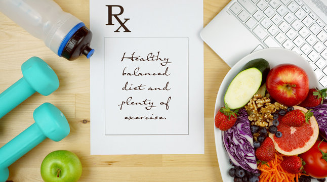 Prescription For Good Health Overhead With Stethoscope, Healthy Fresh Food And Exercise Equipment.