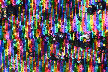 Fototapeta na wymiar A background of colorful small metal plates.
