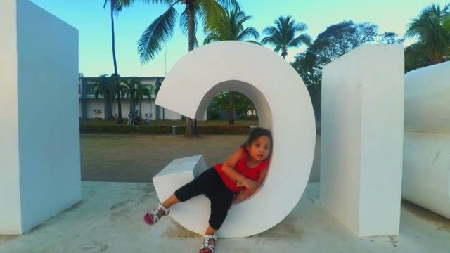 A Cute Little Child Enjoying the 3d Word Sculpture in Olongapo Subic Bay Park, Philippines