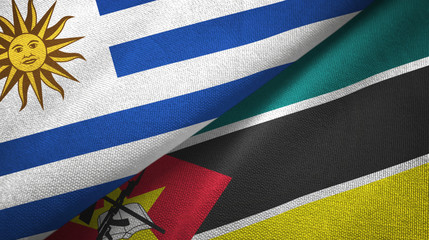 Uruguay and Mozambique two flags textile cloth, fabric texture