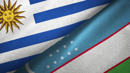 Uruguay and Uzbekistan two flags textile cloth, fabric texture