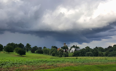 Storm clouds over a farm