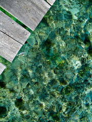 Wooden dock over turquoise waters