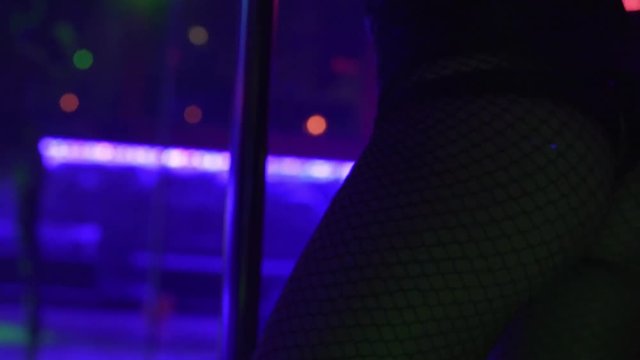 close up of a sexy lap dancer dancing in a night club
