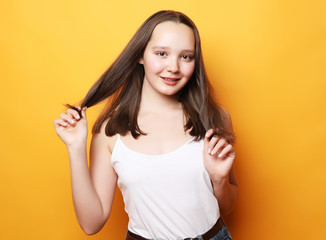 Portrait of young positive female with cheerful expression