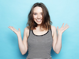 Portrait of young positive female with cheerful expression