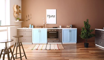 Modern interior of kitchen with stylish furniture