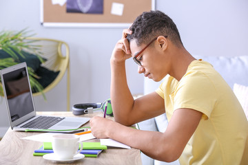 African-American teenage boy doing homework