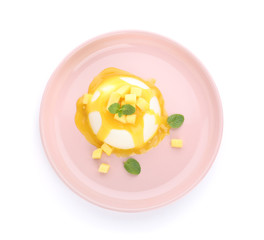 Plate with tasty panna cotta on white background