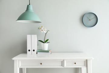 Table near light wall in room
