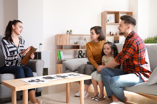 Family visiting psychologist in office