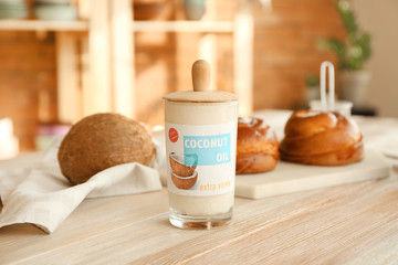 Jar of coconut oil on table in kitchen