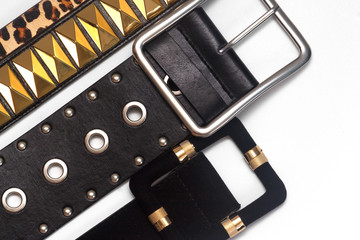 Collection of women's trendy leather belts on white background. Women's fashion accessories....