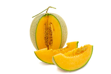 Closeup melon bright colors that is turned and pieces isolated on white background.