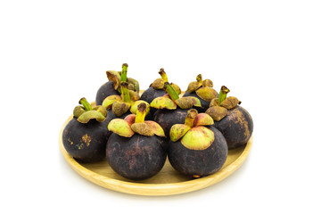 Fresh mangosteen on wooden plate isolated on white background
