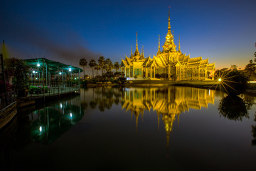 Fototapeta na wymiar Wallpaper Wat Lan Boon Mahawihan Somdet Phra Buddhacharn(Wat Non Kum)is the beauty of the church that reflects the surface of the water, popular tourists come to make merit and take a public photo 