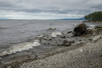 The shore of Lake Baikal in cloudy weather