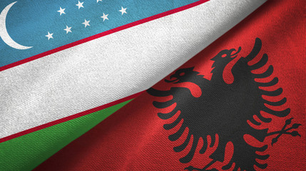 Uzbekistan and Albania two flags textile cloth, fabric texture
