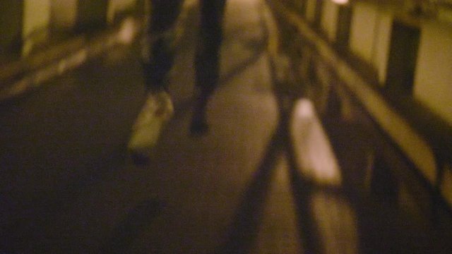 Close up of feet running away at night