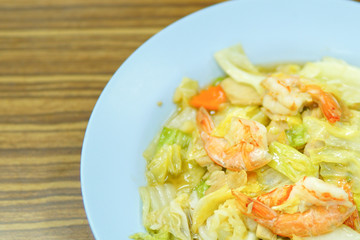 Fried vegetables with shrimp on white dish