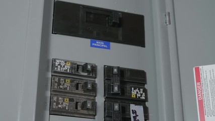Switches in Circuit Breaker Box CLOSE UP SLIDE RIGHT