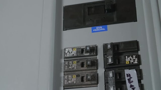 Switches in Circuit Breaker Box CLOSE UP SLIDE LEFT