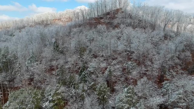 Snow covered hills of Appalachian Mountains in Eastern Kentucky aerial POV