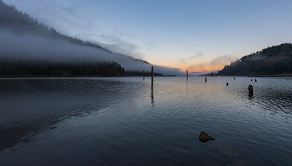 Northern end of Lake Coeur d'Alene Idaho at morning with fog over mountains