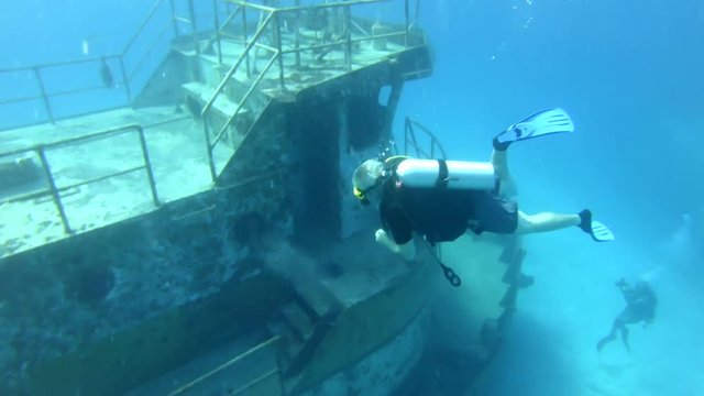 Scuba Diver Exploring Boat Wreck in Nassau