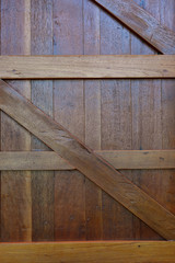 closed timber wood door of warehouse industry, design of rustic wooden barn wall background