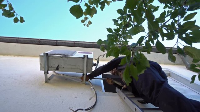 Technican engineer Doing Air Conditioner Maintenance, Instalation