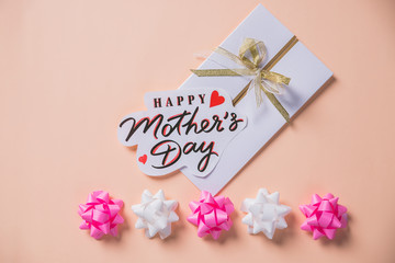 Fototapeta na wymiar Mother's day background, pastel background with greeting card.Concept for Happy Mothers Day.creative minimalism
