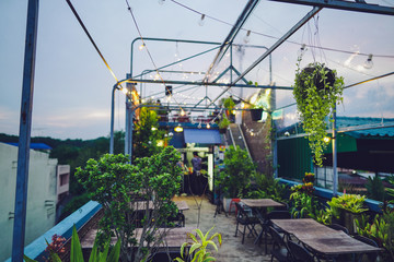 Rooftop restaurant Decorated with trees in the evening