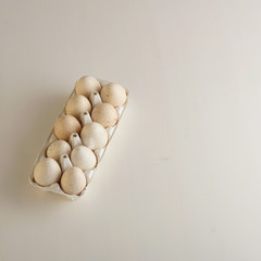 Ten turkey eggs with white paper box.