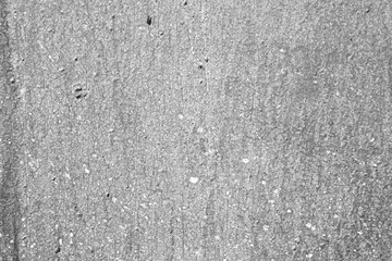 Old painted wall background texture close up. Black and white