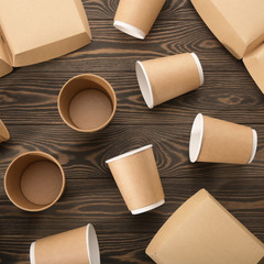 Biodegradable tableware on wooden background. Environmental protection. Secondary processing. The concept of zero waste.
