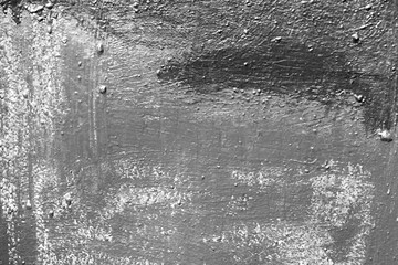 Old painted wall background texture close up. Black and white